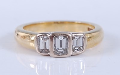 Lot 2545 - An 18ct yellow and white gold diamond three...