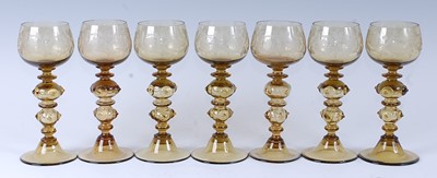 Lot 1051 - A set of seven 20th century German amber glass...