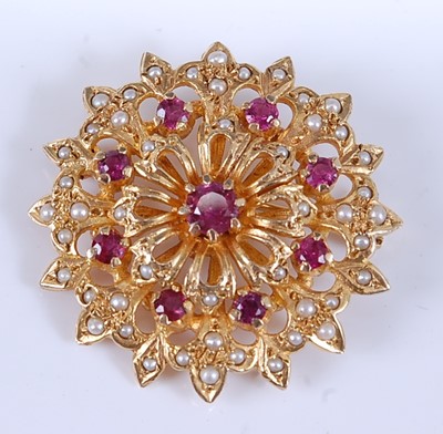 Lot 2548 - A yellow metal, ruby and pearl circular...