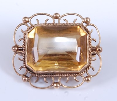 Lot 2549 - A yellow metal citrine brooch, featuring a...