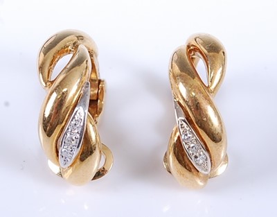 Lot 2560 - A pair of yellow metal diamond half hoop...