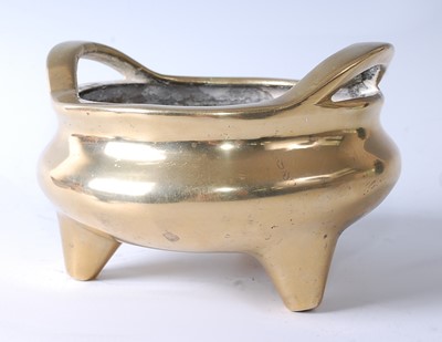 Lot 1280 - A 19th century Chinese bronze tripod censer,...