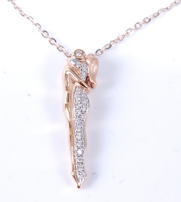 Lot 2573 - A rose and white metal diamond pendant in the...