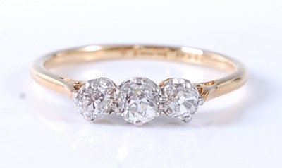 Lot 2567 - A yellow and white metal diamond three stone...