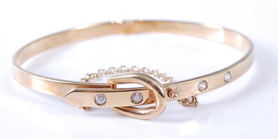 Lot 2570 - A 9ct yellow gold hinged oval buckle style...