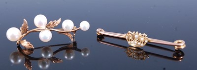 Lot 456 - Two brooches, being a yellow metal safety pin...