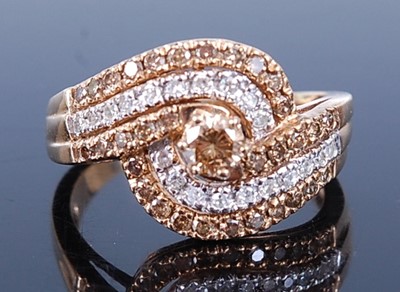 Lot 2585 - A 9ct yellow gold crossover diamond ring,...