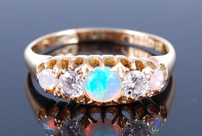 Lot 2597 - An 18ct yellow gold, opal and diamond half...