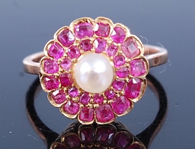 Lot 2603 - A rose metal, ruby and pearl circular cluster...