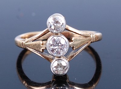 Lot 2626 - A yellow and white metal diamond three-stone...