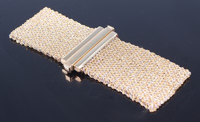 Lot 2633 - A 9ct yellow and white gold flat meshlink...