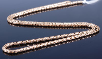 Lot 2622 - A yellow metal boxlink long necklace, stamped...