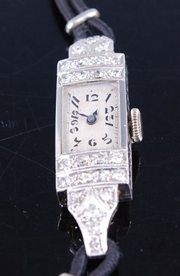 Lot 2623 - An Art Deco white metal cased lady's tank...