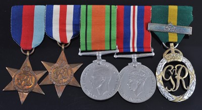 Lot 144 - A group of five medals, to include 1939-1945...