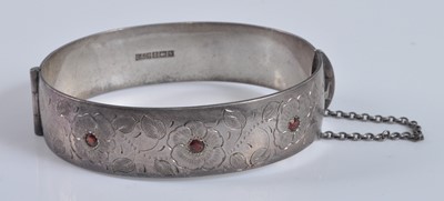 Lot 2637 - A Victorian style silver hinged bangle, one...