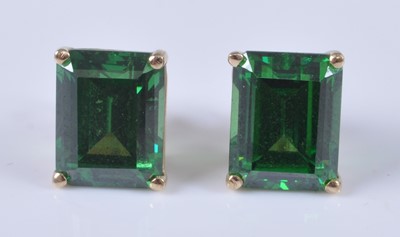 Lot 2659 - A pair of yellow metal earrings, each with a...