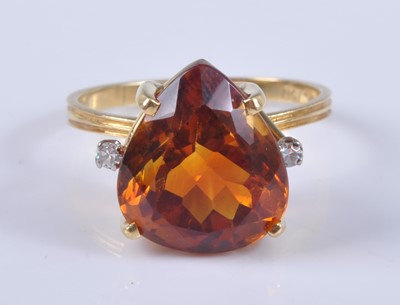 Lot 2663 - A yellow metal, citrine and diamond dress ring,...