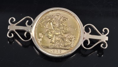 Lot 2680 - A 9ct gold sovereign brooch, set with a single...