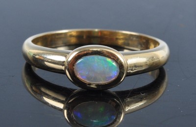Lot 2681 - A yellow metal opal dress ring, as an illusion...