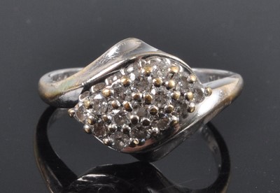 Lot 2666 - A contemporary 18ct white gold diamond cluster...