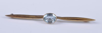 Lot 2672 - A yellow metal aquamarine bar brooch, the oval...