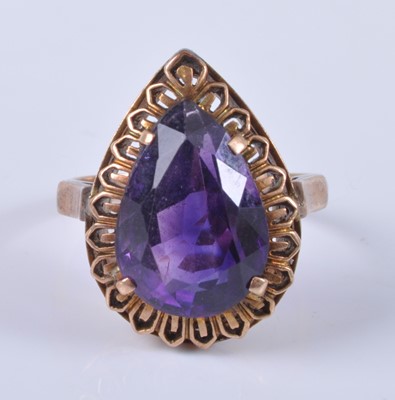 Lot 2678 - A yellow metal and amethyst set dress ring,...