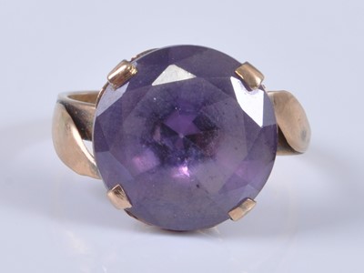Lot 2686 - A mid-20th century yellow metal amethyst dress...