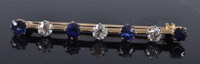 Lot 2694 - A yellow metal, sapphire and diamond...