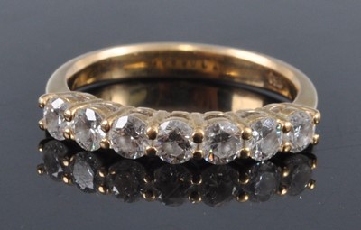 Lot 2701 - A contemporary yellow metal diamond half hoop...