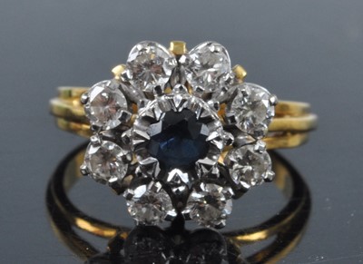 Lot 2703 - An 18ct gold, sapphire and diamond flower head...