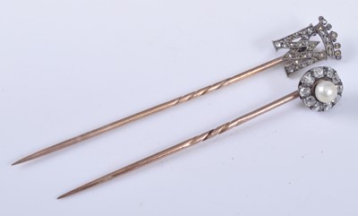 Lot 1204 - Two yellow and white metal diamond set stick...