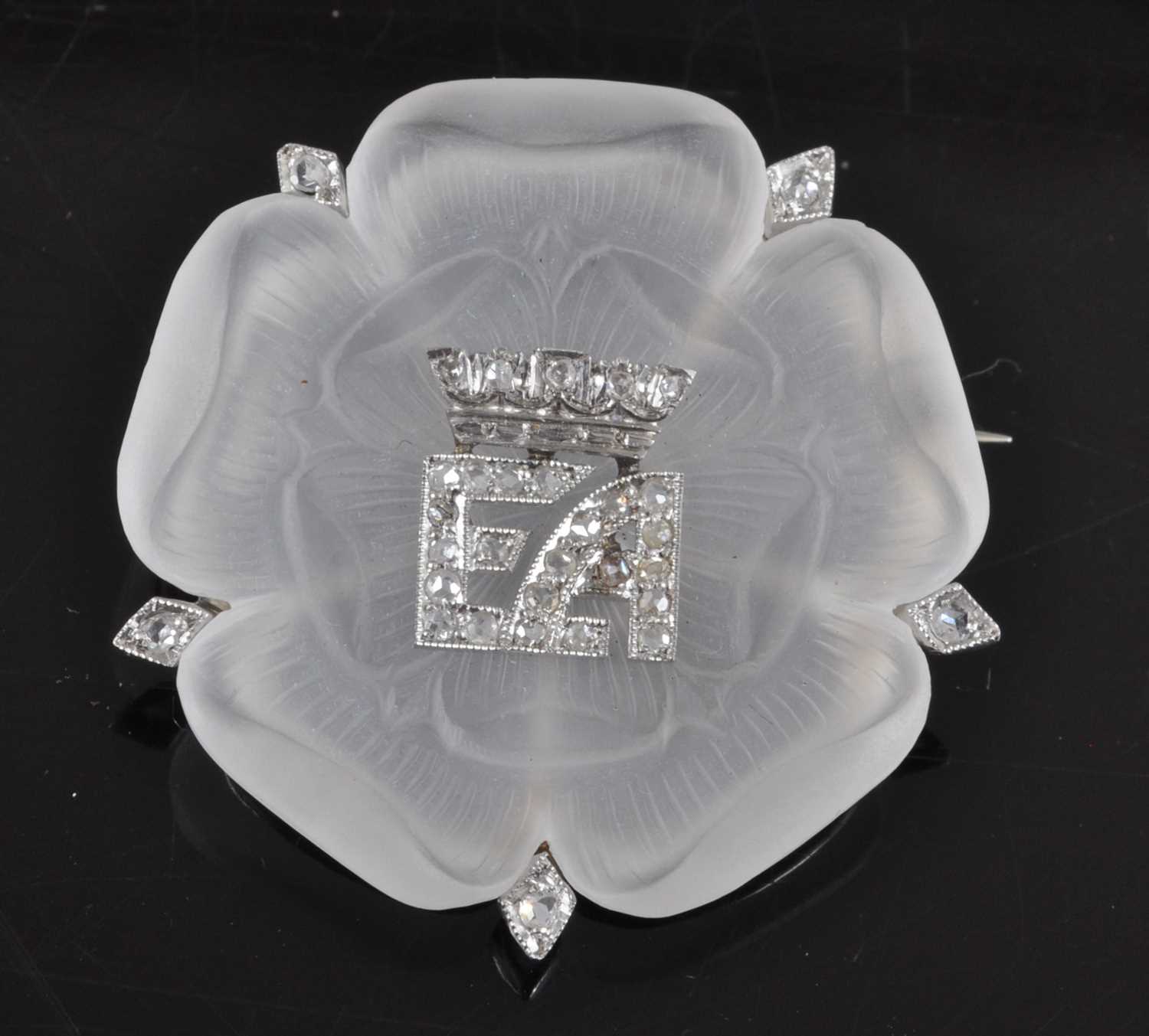 Lot 1195 - A white metal carved rock crystal Tudor Rose...