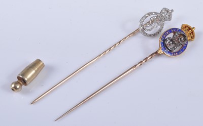 Lot 1198 - Two yellow metal royal monogram stick pins,...