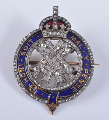 Lot 1205 - A yellow and white metal diamond set Queen...