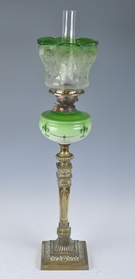 Lot 1255 - A Victorian brass oil lamp, having an acid...