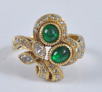 Lot 1130 - A yellow metal, emerald and diamond...