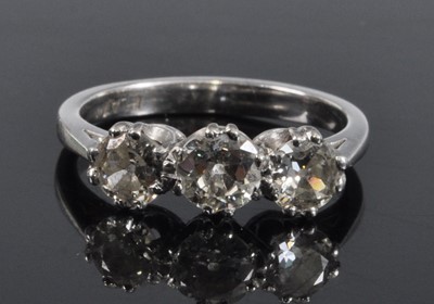 Lot 1131 - A white metal diamond three stone...