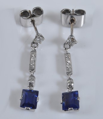 Lot 1145 - A pair of white metal Art Deco style sapphire...