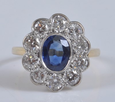 Lot 1152 - A yellow and white metal, sapphire and diamond...