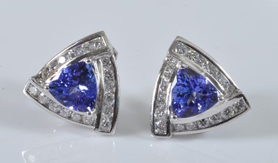Lot 1156 - A pair of white metal, tanzanite and diamond...