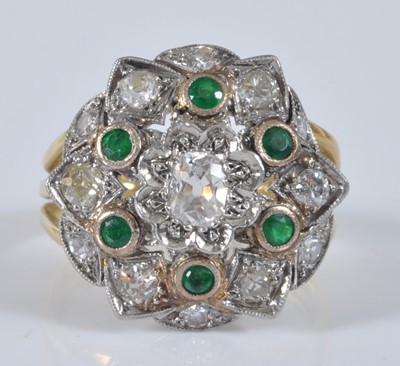 Lot 1158 - A yellow and white metal, emerald and diamond...