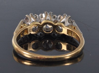 Lot 1162 - A yellow and white metal diamond three stone...