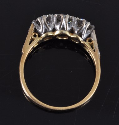 Lot 1162 - A yellow and white metal diamond three stone...