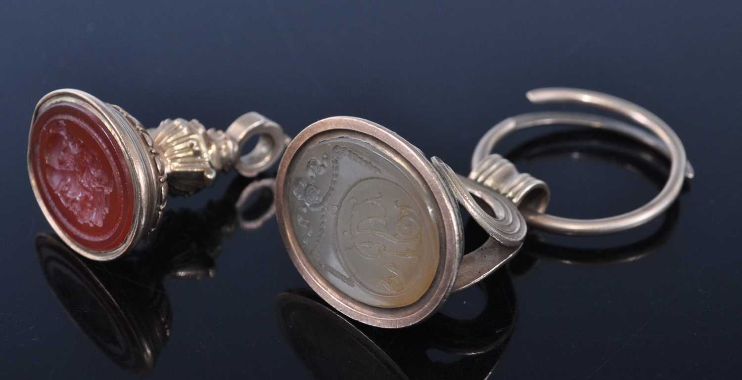 Lot 1137 - An early 19th century yellow metal fob seal,...