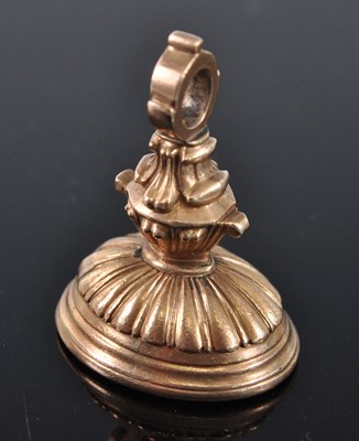 Lot 1137 - An early 19th century yellow metal fob seal,...