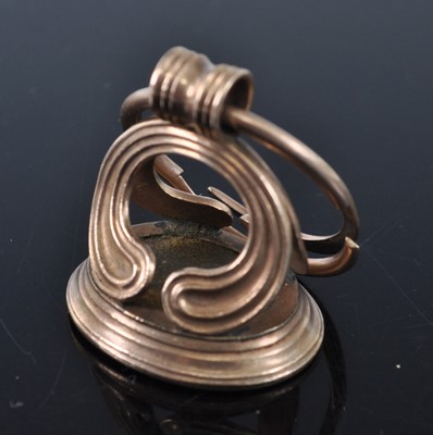 Lot 1137 - An early 19th century yellow metal fob seal,...