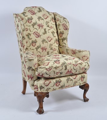 Lot 1434 - A walnut framed wing armchair in the 18th...