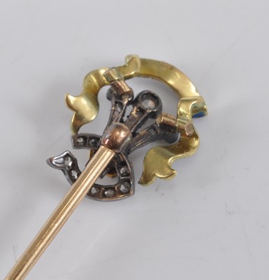 Lot 1203 - A yellow and white metal, enamel and diamond...