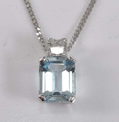Lot 1179 - A white metal, aquamarine and diamond pendant,...