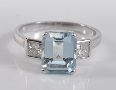 Lot 1180 - A white metal, aquamarine and diamond three...
